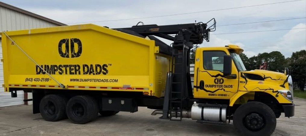 Dumpster Dads dumpster delivery truck in Charleston, SC